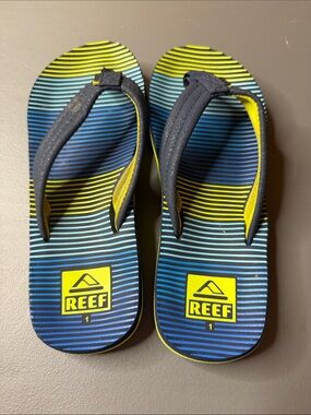 Kid’s Reef Blue & Yellow Striped Flip Flops. Size: 1